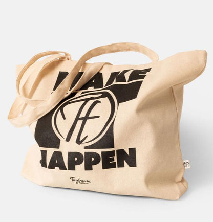 Ein Shopper aus Bio-Baumwolle, naturfarben, mit coolem, schwarzem "Make it happen" Print